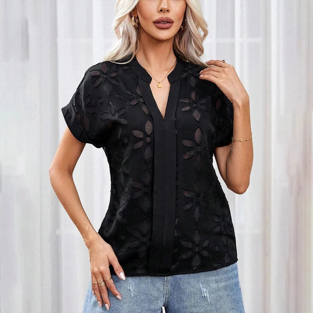 Blus med blommigt hålmönster